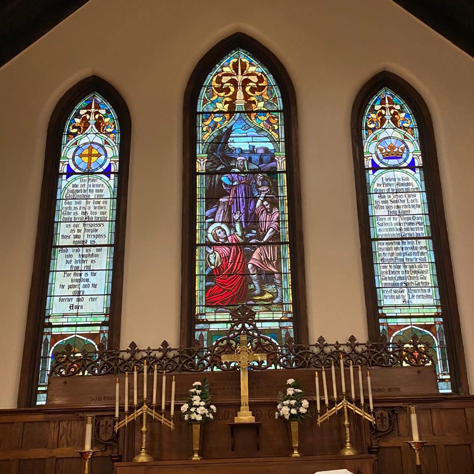 Photo of the sanctuary & stain glass windows